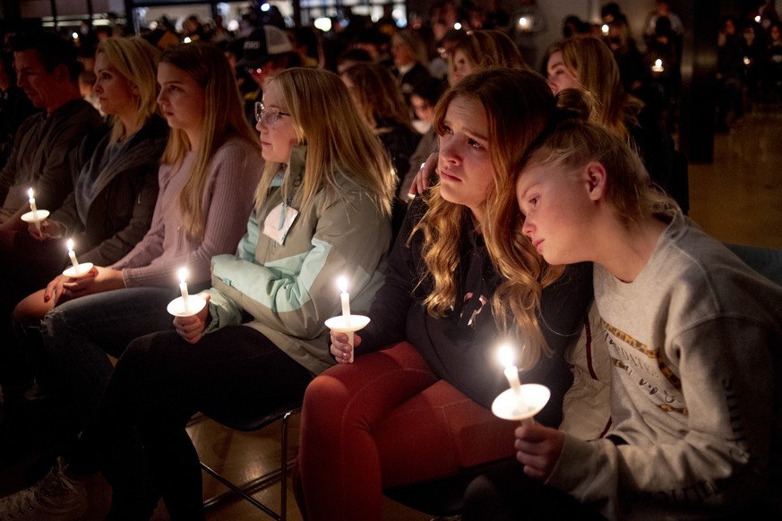 Emerson Miller, right, leans on her friend Joselyn&#039;s shoulder as they listen to Jessi Holt, pastor at LakePoint Community Church, during a prayer vigil at the church after the Oxford High School  ...