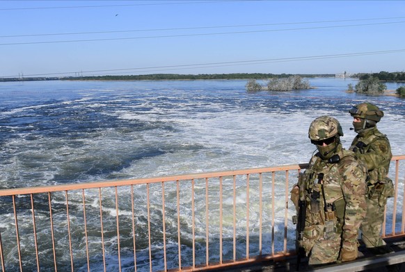 Ukraine Russia Military Operation Hydroelectric Station 8195902 20.05.2022 Russian servicemen are seen at the dam of the North Crimean Canal in Kherson region, Ukraine. The North Crimean Canal starts ...