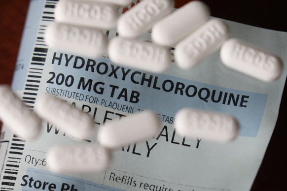 This Monday, April 6, 2020, photo shows an arrangement of Hydroxychloroquine pills in Las Vegas. President Donald Trump and his administration are keeping up their out-sized promotion of the anti-mala ...