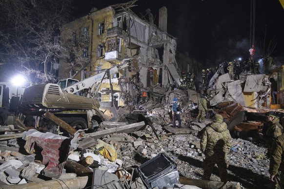 Emergency workers clear the rubble after a Russian rocket hit an apartment building in Kramatorsk, Ukraine, on Thursday, Feb. 2, 2023. At least 3 people were killed and 21 wounded in the attack. (AP P ...