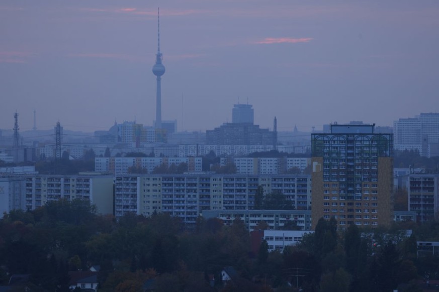 BERLIN, GERMANY - OCTOBER 13: East Germany-era apartment buildings stand in Marzahn district on the eastern city outskirts as the broadcast tower at Alexanderplatz stands behind on October 13, 2022 in ...