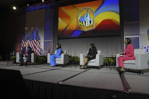 Republican presidential candidate former President Donald Trump, left, moderated by ABC&#039;s Rachel Scott, Semafor&#039;s Nadia Goba and FOX News&#039; Harris Faulkner, speaks at the National Associ ...