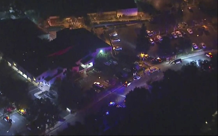 In this image made from aerial video, police vehicles block an intersection in the vicinity of a shooting in Thousand Oaks, California, early Thursday, Nov. 8, 2018. Authorities say there were multipl ...