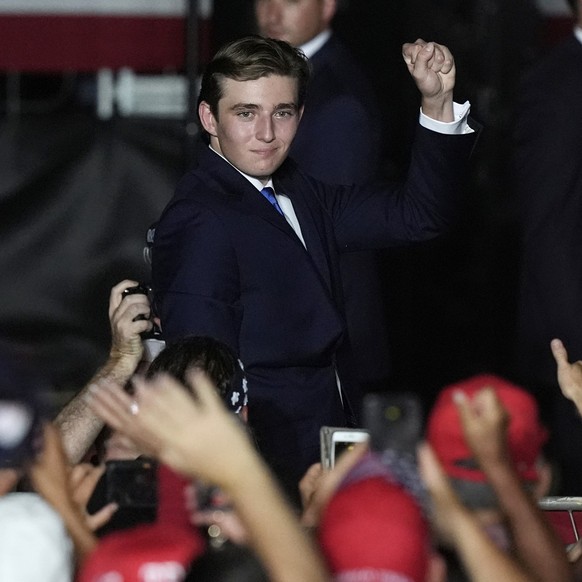 Barron Trump gestures after his father Republican presidential candidate former President Donald Trump introduced him during a campaign rally at Trump National Doral Miami, Tuesday, July 9, 2024, in D ...