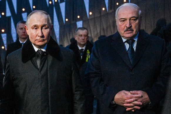 RUSSIA, LENINGRAD REGION - JANUARY 27, 2024: Russia s President Vladimir Putin L and Belarus President Alexander Lukashenko attend the unveiling of a WWII memorial to the Nazi genocide victims in the  ...