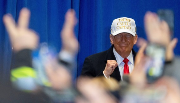 Syndication: The Indianapolis Star Former President Donald Trump pumps his fist during a campaign event ahead of the Iowa Caucus on Sunday, Jan. 14, 2024, at Simpson College in Indianola. , EDITORIAL  ...
