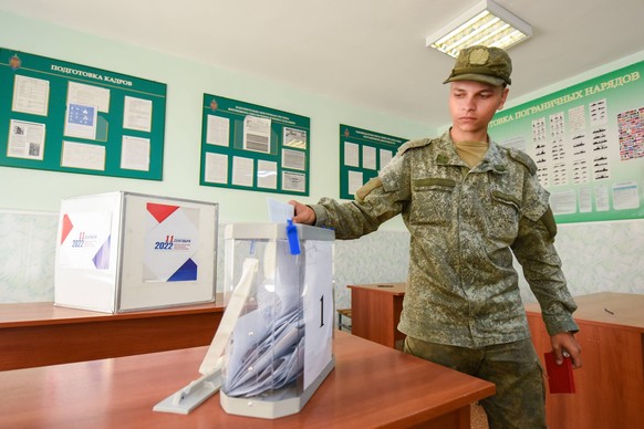 SAKHALIN REGION, RUSSIA AUGUST 29, 2022: A military serviceman casts his ballot at a polling station at Military Unit No.21527-5 on Cape Krillion on Sakhalin in the Russian Far East, during early voti ...