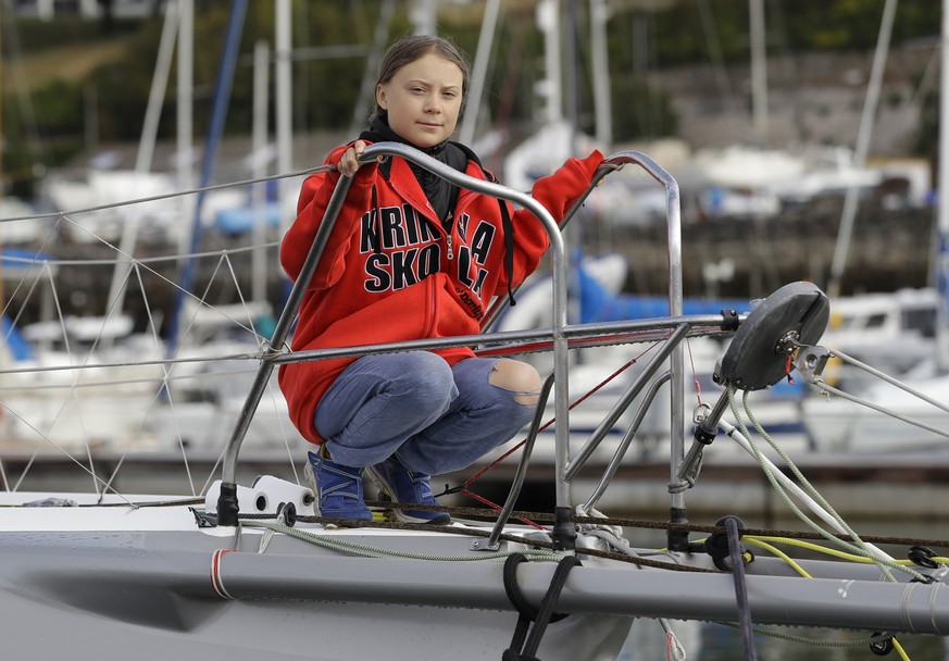 Greta Thunberg poses for a picture on the boat Malizia as it is moored in Plymouth, England Tuesday, Aug. 13, 2019. Greta Thunberg, the 16-year-old climate change activist who has inspired student pro ...