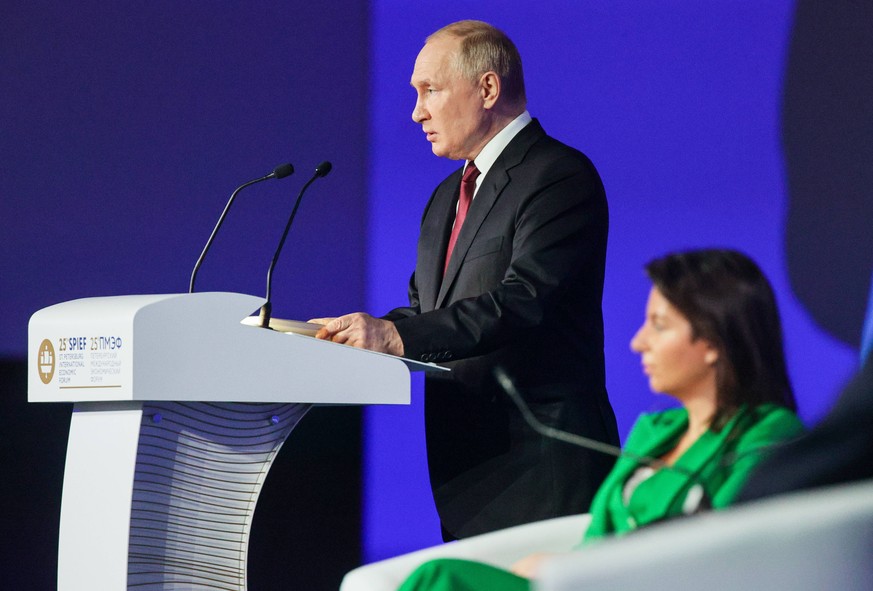 ST PETERSBURG, RUSSIA JUNE 17, 2022: Russia s President Vladimir Putin L and RT editor-in-chief Margarita Simonyan attend a plenary session at the 2022 St Petersburg International Economic Forum SPIEF ...