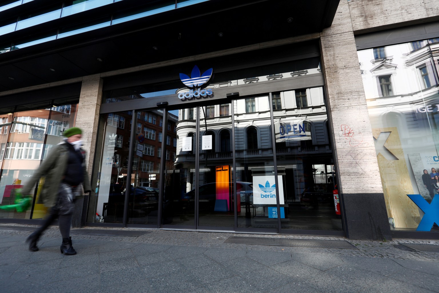 A closed store of Adidas is pictured, following an outbreak of the coronavirus disease (COVID-19), in Berlin, Germany March 27, 2020. REUTERS/Michele Tantussi