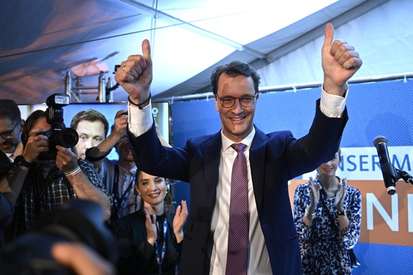 DUSSELDORF, GERMANY - MAY 15: Hendrik Wuest, incumbent and lead candidate of the German Christian Democrats (CDU), celebrates with supporters after the exit polls for the North-Rhine Westphalia state  ...