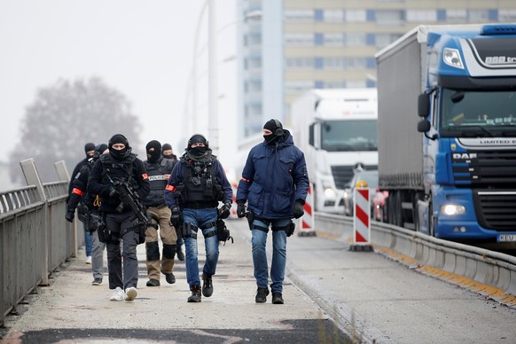 Members of French special police forces of Research and Intervention Brigade (BRI) patrol at the French-German border the day after a shooting in Strasbourg, France, December 12, 2018. REUTERS/Vincent ...