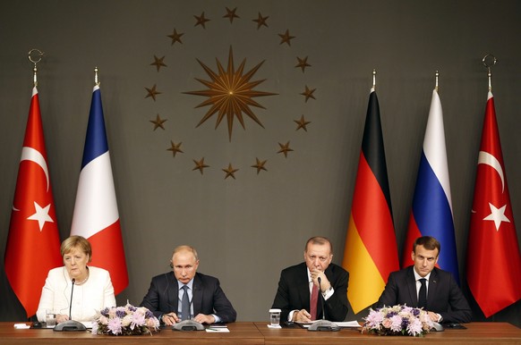 From left, German Chancellor Angela Merkel, Russian President Vladimir Putin,Turkey's President Recep Tayyip Erdogan and French President Emmanuel Macron attend a news conference following their summi ...