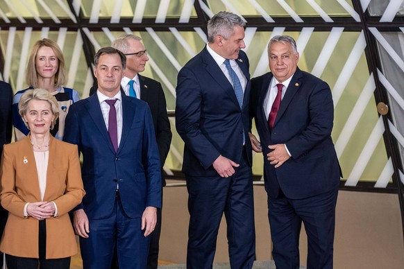 BRUSSELS - Prime Minister Viktor Orban is the last to arrive during the family photo at a summit with leaders of the European Union and the Western Balkans. Discussions included Ukraine s accession to ...