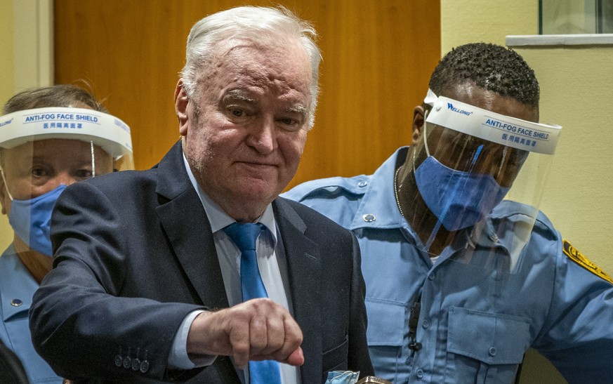 Former Bosnian Serb military chief Ratko Mladic enters the court room in The Hague, Netherlands, Tuesday, June 8, 2021, where the United Nations court delivers its verdict in the appeal of Mladic agai ...