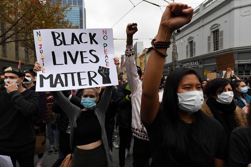 BLM PROTEST MELBOURNE, Protesters are seen during a Black Lives Matter rally in Melbourne, Saturday, June 6, 2020. The rally is in solidarity with the US protests over the killing of George Floyd, and ...