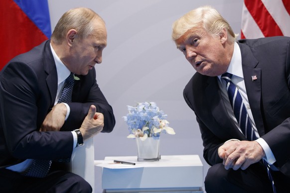 FILE - In this Friday, July 7, 2017, file photo U.S. President Donald Trump meets with Russian President Vladimir Putin at the G-20 Summit in Hamburg. The Kremlin and the White House have announced Th ...