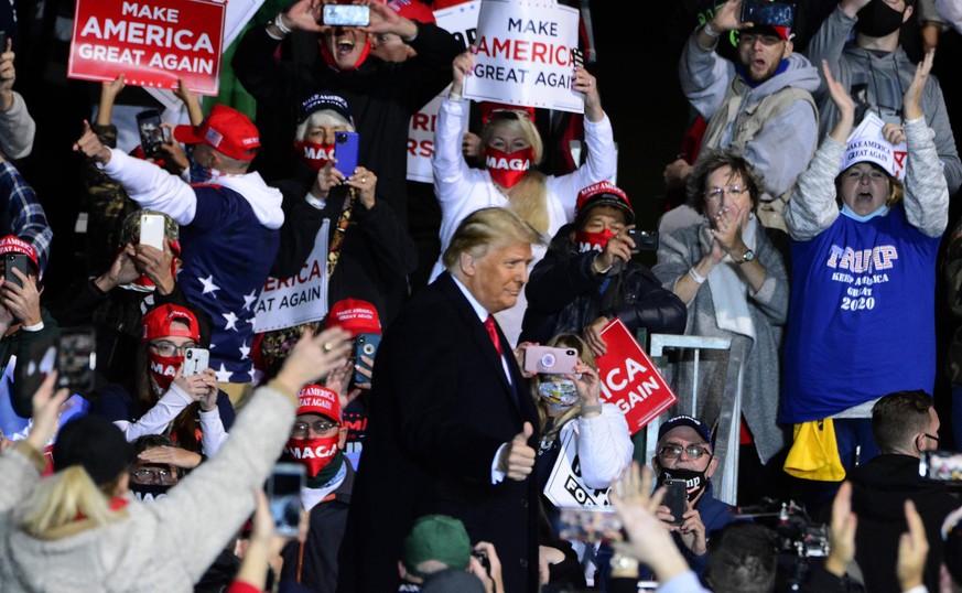 President Donald Trump gives the thumbs up to his supporters during a rally at the John Murtha Johnstown-Cambria County Airport, near Johnstown, Pennsylvania on Tuesday, October 13, 2020. PUBLICATIONx ...