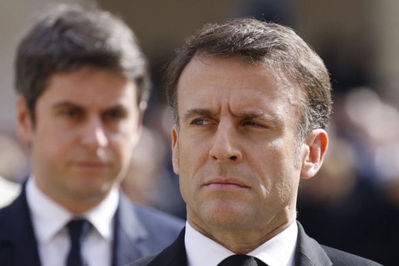 FILE - French Prime Minister Gabriel Attal, left, and French President Emmanuel Macron attend a &quot;national tribute&quot; ceremony to late French politician and admiral, Philippe de Gaulle, son of  ...