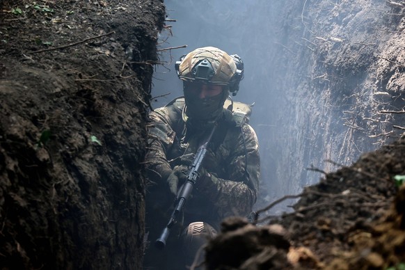 Tactical drills of Spartan Brigade UKRAINE - JULY 22, 2024 - A serviceman of the 3rd Colonel Petro Bolbochan Brigade of Operational Assignment of Ukraines National Guard also known as the Spartan Brig ...