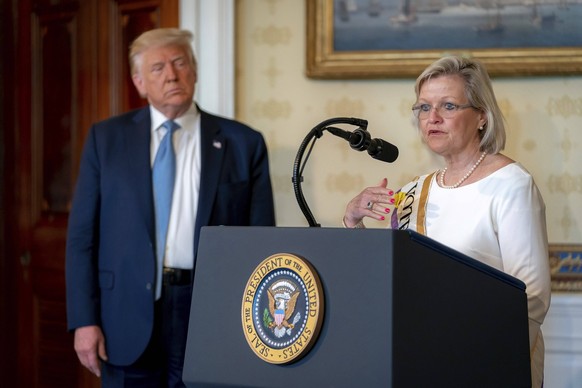 U.S President Trump Marks Anniversary of Womans Right to Vote August 18, 2020, Washington, DC, United States of America: U.S. President Donald Trump looks on as conservative activist Cleta Mitchell de ...