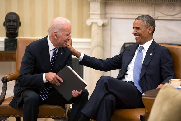 July 21, 2014 - Washington, DC, United States of America - US President Barack Obama and Vice President Joe Biden share a laugh in the Oval Office of the White House July 21, 2014 in Washington, DC. B ...