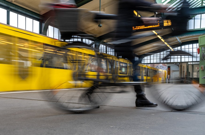 Blurred Motion Of Train and Person At Railroad Station