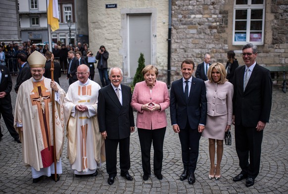 AACHEN, GERMANY - MAY 10: Bishop Helmut Dieser (L-R), Provost Manfred von Holtum, former mayor of Aachen Juergen Linden, German Chancellor Angela Merkel, French President Emmanuel Macron, his wife Bri ...