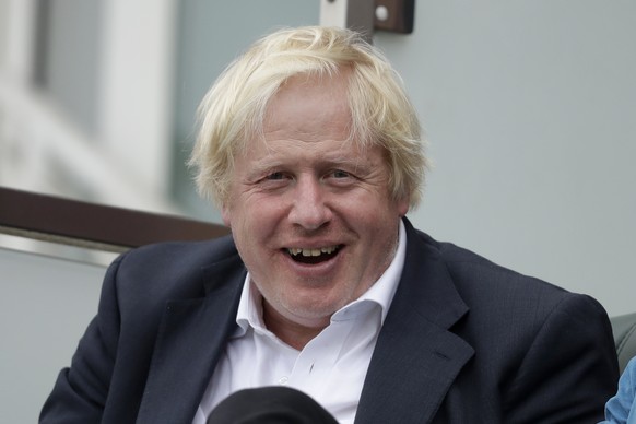FILE - In this Saturday, Sept. 8, 2018 file photo, Britain's former Foreign Secretary Boris Johnson reacts to seeing photographers taking his picture as he sits in a spectator seat whilst attending th ...