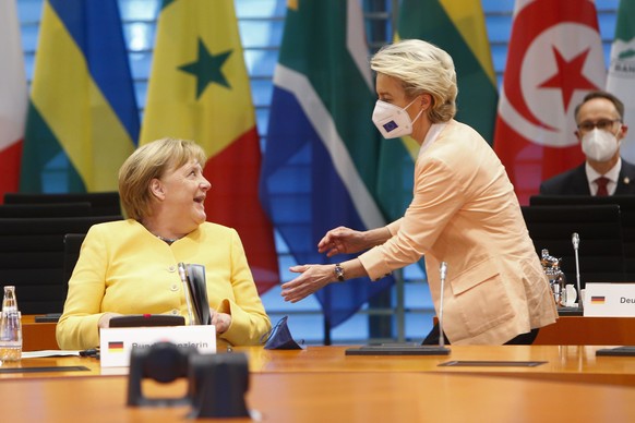 BERLIN, GERMANY - AUGUST 27: Commission President Ursula von der Leyen greets German Chancellor Angela Merkel at the G20 Compact with Africa (CwA) meeting in Berlin, Germany, August 27, 2021. (Photo b ...