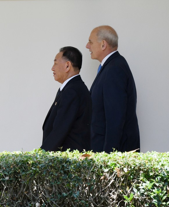 Chief of staff John Kelly walks along the Colonnade toward the Oval Office with Kim Yong Chol, former North Korean military intelligence chief and one of leader Kim Jong Un's closest aides, as he arri ...
