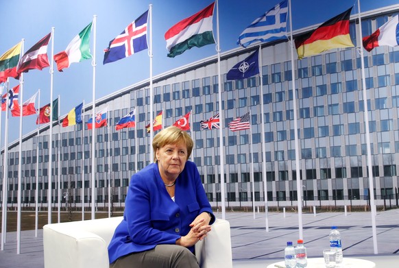 German Chancellor Angela Merkel look on as she attends a bilateral meeting with U.S. President Donald Trump during the NATO Summit in Brussels, Belgium July 11, 2018. REUTERS/Kevin Lamarque