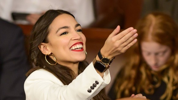 January 3, 2019 - Washington, District of Columbia, U.S. - United States Representative Alexandria Ocasio-Cortez (Democrat of New York) gestures towards someone in the gallery as the 116th Congress co ...