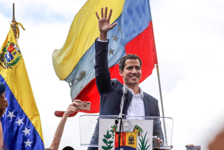 Juan Guaido, President of the Venezuelan Parliament, speaks to supporters as he announces that he assumes executive powers, in Caracas, Venezuela, 23 January 2019. Guaido declared himself interim pres ...