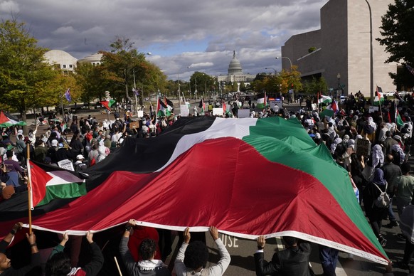 People march towards the U.S. Capitol during a pro-Palestinian march calling for a ceasefire in Gaza, Saturday, Oct. 21, 2023, in Washington. (AP Photo/Andrew Harnik)