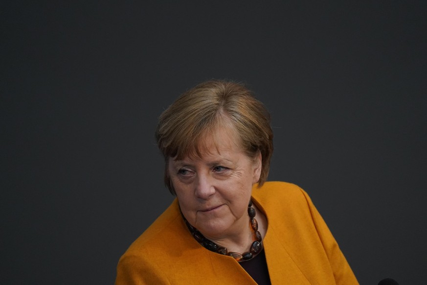 BERLIN, GERMANY - MARCH 24: German Chancellor Angela Merkel takes questions form parliamentarians at the Bundestag after she announced a reversal of a hard lockdown for Easter on March 24, 2021 in Ber ...