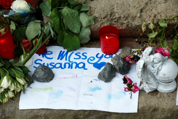 Messages of mourning, candles and flowers are placed by people for Susanna F., the teenager who was found dead two days ago, in Wiesbaden-Erbenheim, Germany, June 8, 2018. REUTERS/Ralph Orlowski