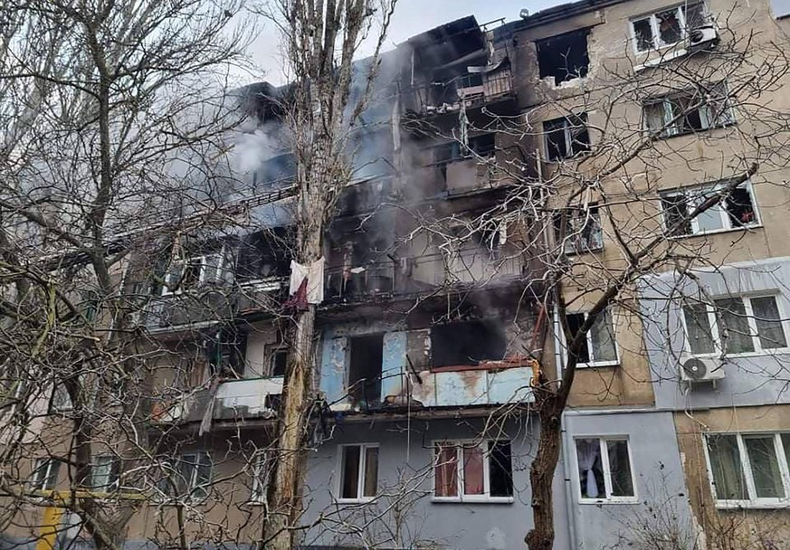 Firefighters extinguish a fire in a damaged residential building after Russia shelled the area in the southern city of Mykolaiv in Ukraine on Monday, March 7, 2022. Ukraine s military says it is fight ...