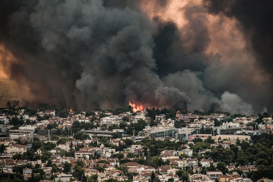 August 3, 2021, Athens, Greece: Flames burn near buildings in Tatoi area, northern Athens. (Credit Image: Â© Eurokinissi via ZUMA Press Wire
