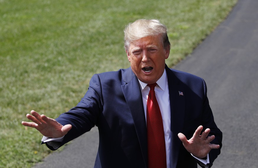 President Donald Trump speaks with reporters before departing on Marine One on the South Lawn of the White House, Wednesday, Aug. 21, 2019, in Washington. Trump is headed to Kentucky. (AP Photo/Patric ...