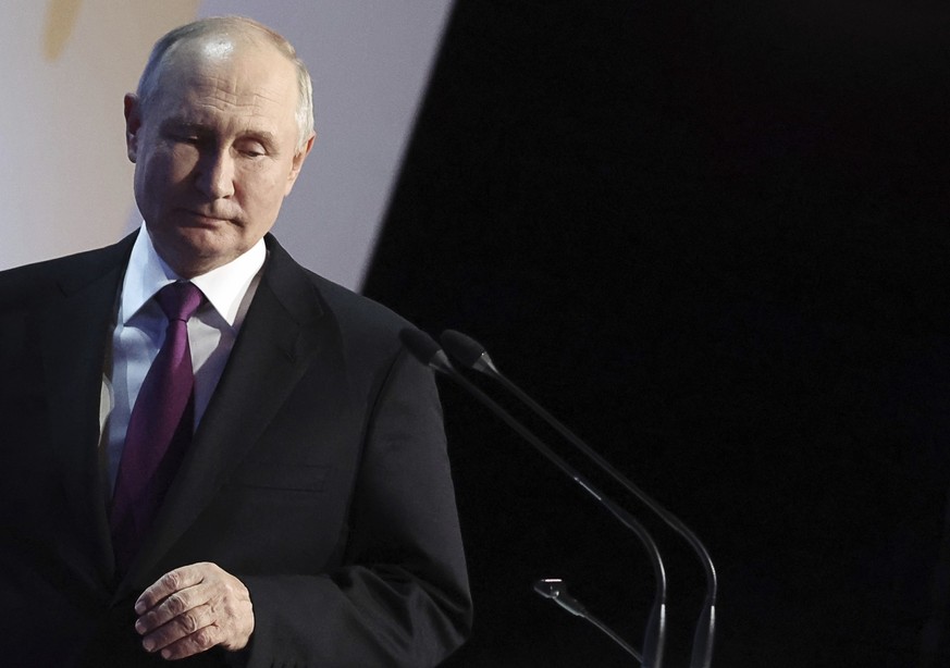 Russian President Vladimir Putin arrives to deliver a speech during a concert dedicated to the 100th birth anniversary of Soviet and Russian poet Rasul Gamzatov at the State Kremlin Palace in Moscow,  ...