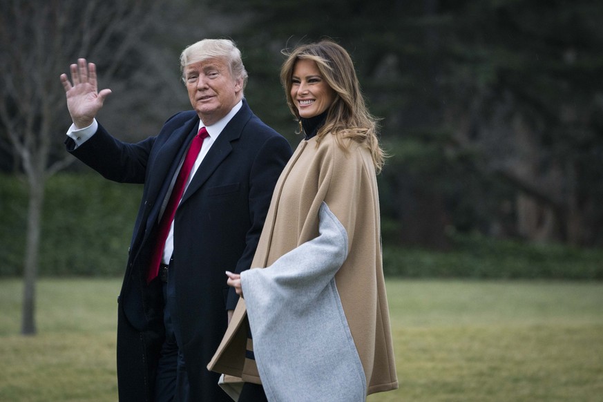 WASHINGTON, DC - JANUARY 31: U.S. President Donald Trump and First Lady Melania Trump walk along the South Lawn to Marine One as they depart from the White House for a weekend trip to Mar-a-Lago on Ja ...