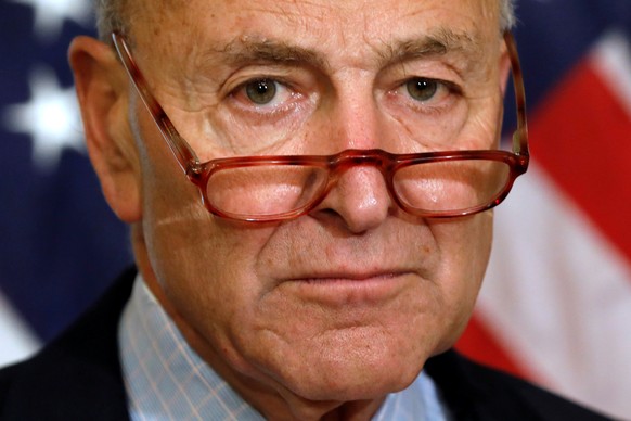 FILE PHOTO: Senate Minority Leader Chuck Schumer (D-NY) looks on as he talks to reporters on Capitol in Washington, U.S., August 1, 2019. REUTERS/Yuri Gripas/File Photo