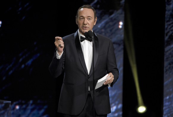 FILE - In this Oct. 27, 2017, file photo, Kevin Spacey presents an award in Beverly Hills, Calif. A Massachusetts prosecutor says Spacey is scheduled to be arraigned Jan. 7, 2019, on a charge of indec ...