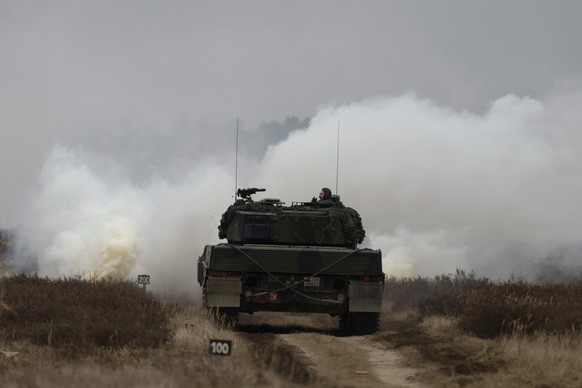 Ukrainian and Polish soldiers drive the Leopard 2 tank during a training at a military base and test range in Swietoszow, Poland, Monday, Feb. 13, 2023. The training is part of the European Union&#039 ...
