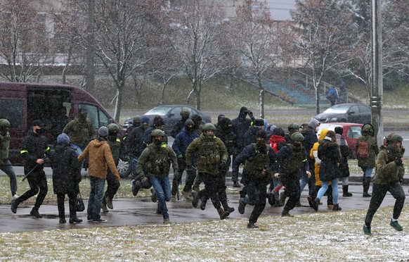 MINSK, BELARUS - NOVEMBER 29, 2020: Law enforcement officers detain participants in the March of Neighbors opposition event. Mass protests are held in Belarus since August 9, the 2020 presidential ele ...
