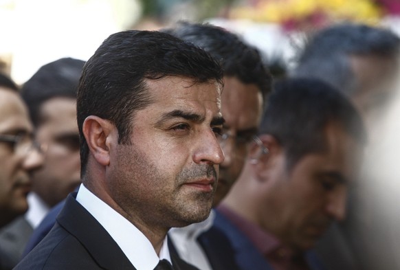 ISTANBUL, TURKEY - OCTOBER 12: Selahattin Demirtas, leader of the pro Kurdish Democratic Party of Peoples (HDP) attends the funeral of one of the victims of Saturday&#039;s bombing attacks on October  ...