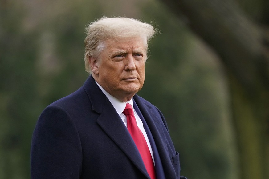 FILE - In this Dec. 12, 2020, file photo President Donald Trump walks on the South Lawn of the White House in Washington before boarding Marine One. Unemployment benefits for millions of Americans str ...