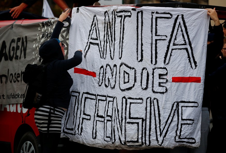 Left wing activists prepare for a demonstration in Koethen, Germany, September 9, 2018, after a 22-year-old German man died overnight in the eastern town of Koethen and two Afghans have been detained  ...