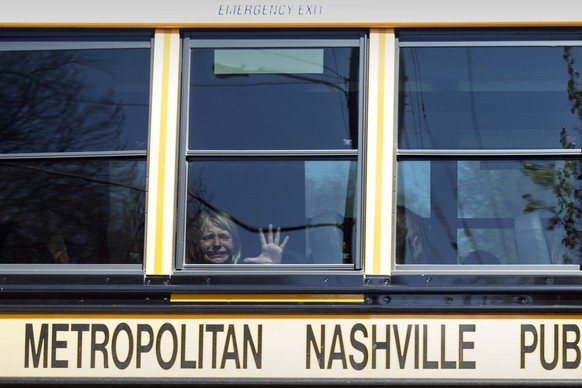 FILE - A child weeps while on the bus leaving The Covenant School following a mass shooting at the school in Nashville, Tenn., Monday, March 27, 2023. A 28-year-old killed three children and three adu ...